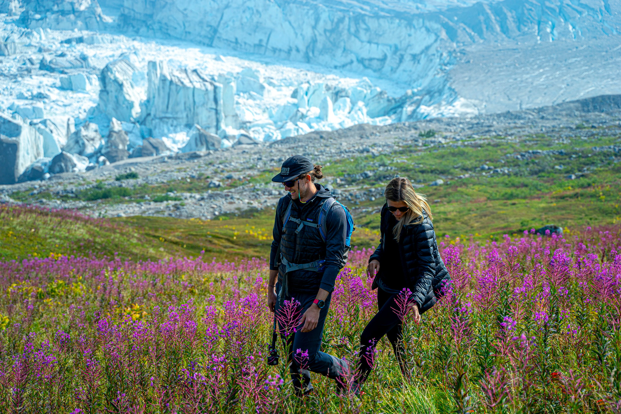 couple hiking fireweed