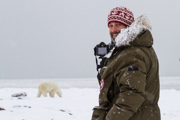 Photographer capturing polar bear photo in the arctic