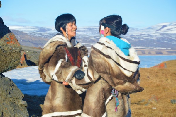 Two Women Holding Each Other While Kataqjjaq Throat Singing