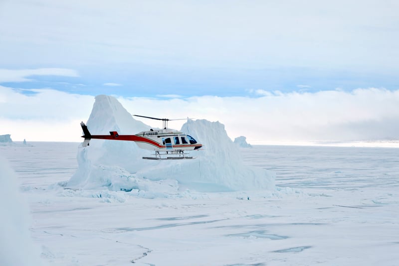 helicopter landing on the snow