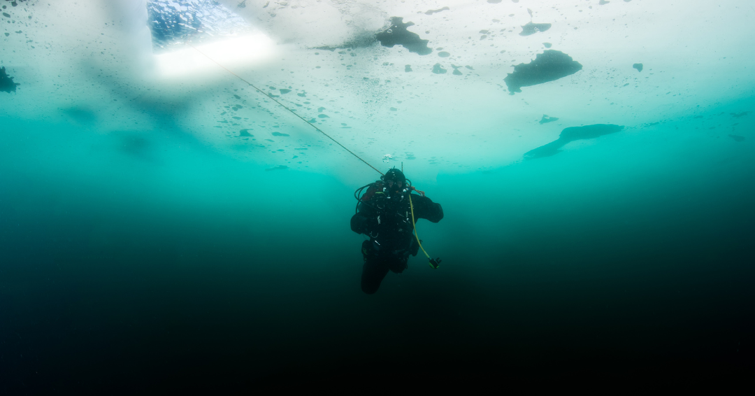 arctic diver under the ice